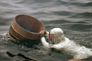 Ama Diver with bucket to hold her catch