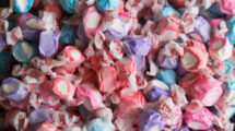 Colorful saltwater taffy candies in various pastel colors, individually wrapped.
