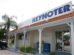 Florida Keys Keynoter building in Marathon, Florida, with a sign featuring the newspaper's name and a palm tree graphic.