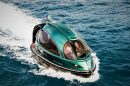 Futuristic green Jet Capsule mini-yacht cruising on open water with passengers visible inside